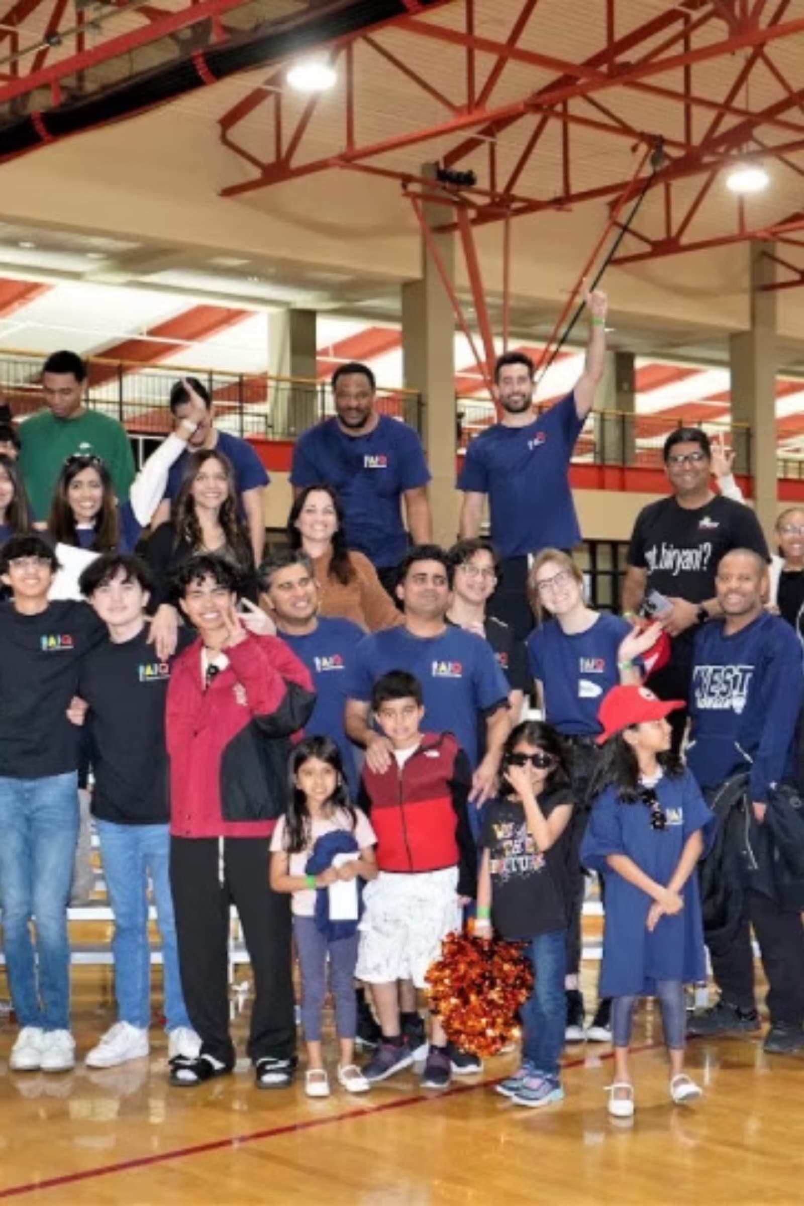 Families and volunteers at the AIQ charity basketball tournament